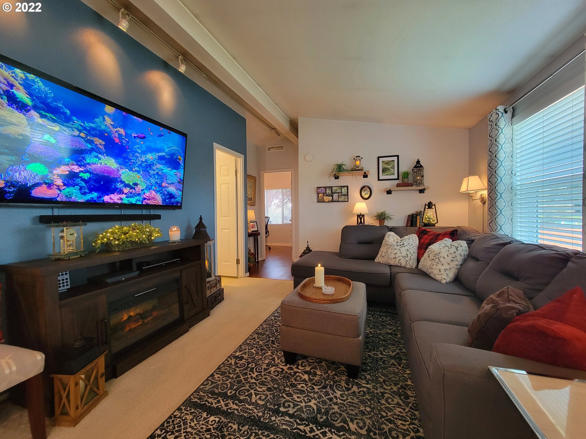 9811 Southwest Herman Road, Unit 43 Tualatin, OR 97062 - Photo 14 of 32 a living room with furniture and a flat screen tv