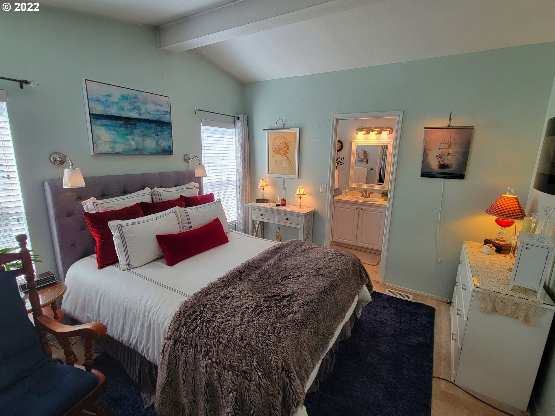 9811 Southwest Herman Road, Unit 43 Tualatin, OR 97062 - Photo 16 of 32 a bedroom with a bed and wooden floor