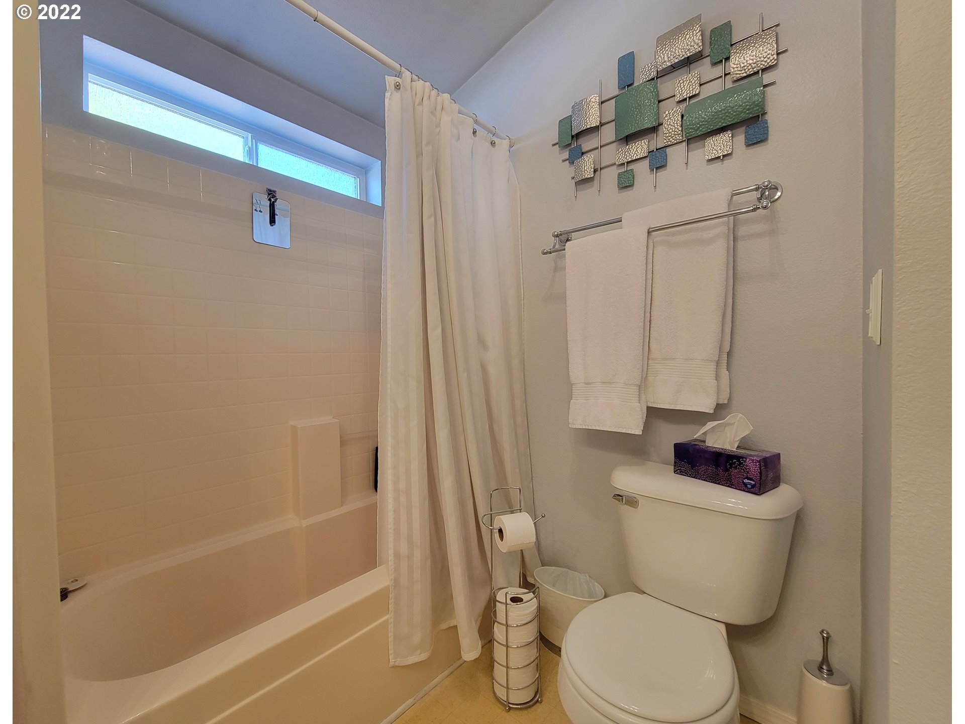9811 Southwest Herman Road, Unit 43 Tualatin, OR 97062 - Photo 24 of 32 a white toilet sitting next to a bath tub