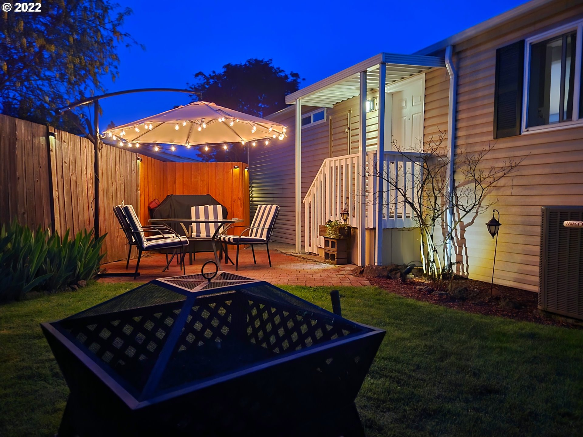 9811 Southwest Herman Road, Unit 43 Tualatin, OR 97062 - Photo 31 of 32 a view of a chairs and table in the patio