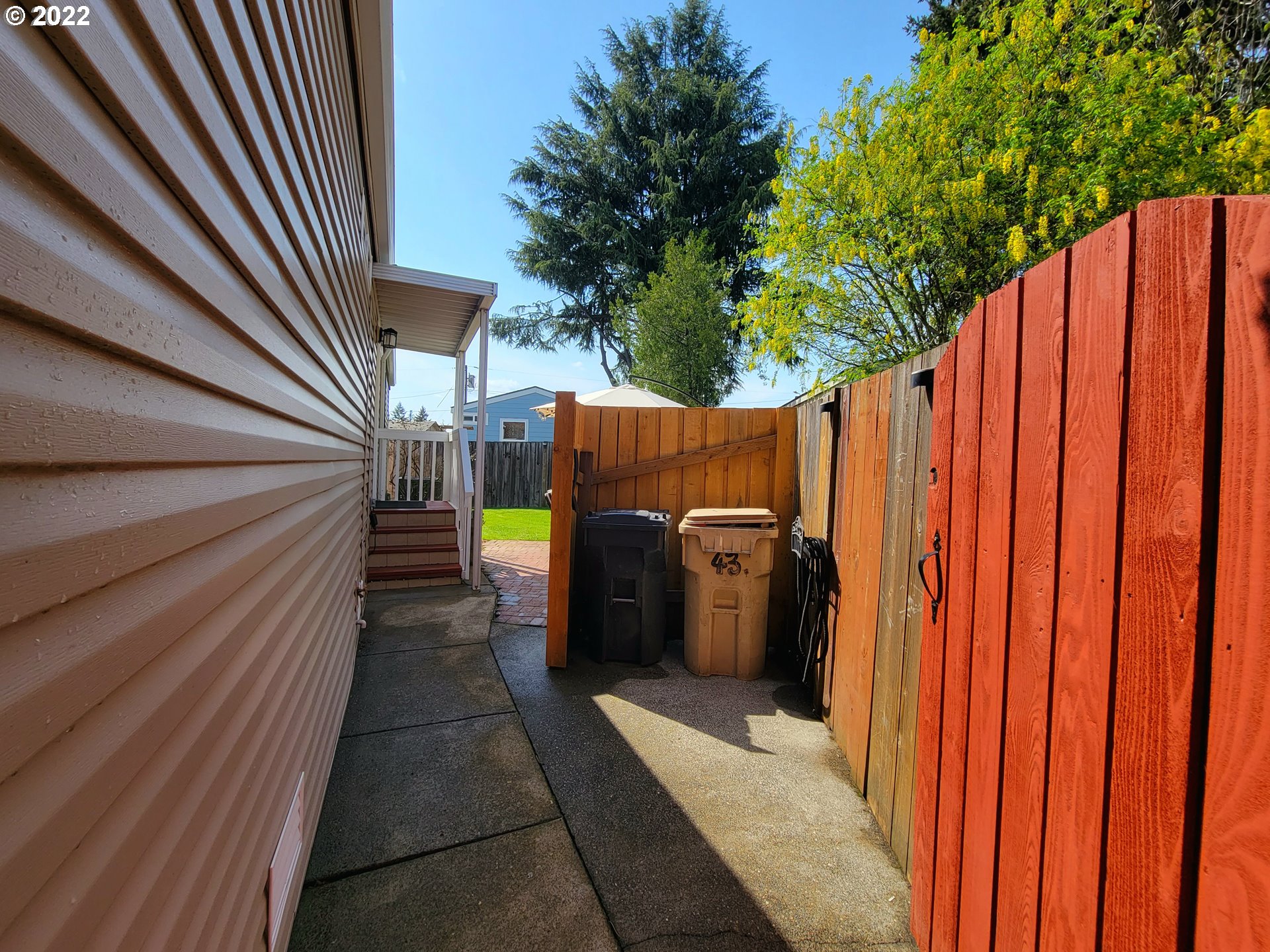9811 Southwest Herman Road, Unit 43 Tualatin, OR 97062 - Photo 5 of 32 a view of outdoor shower in backyard of the house