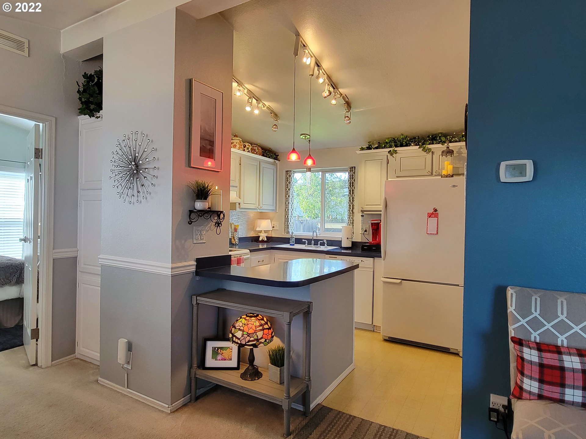 9811 Southwest Herman Road, Unit 43 Tualatin, OR 97062 - Photo 9 of 32 a kitchen with stainless steel appliances granite countertop a refrigerator and a sink