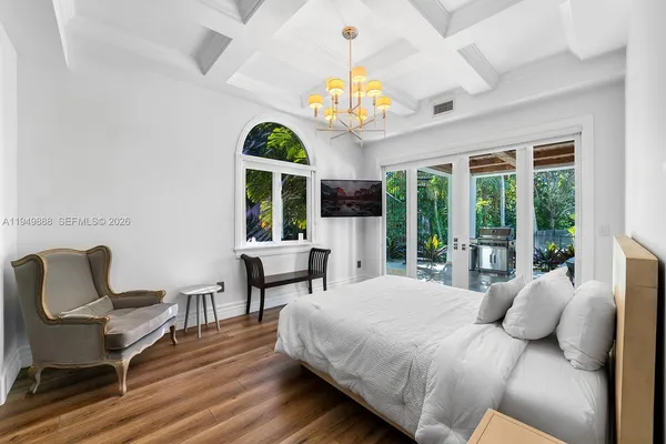 a bedroom with a bed and a chair