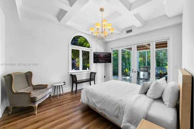 a bedroom with a bed and a chair