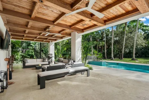 a living room with furniture and a big yard