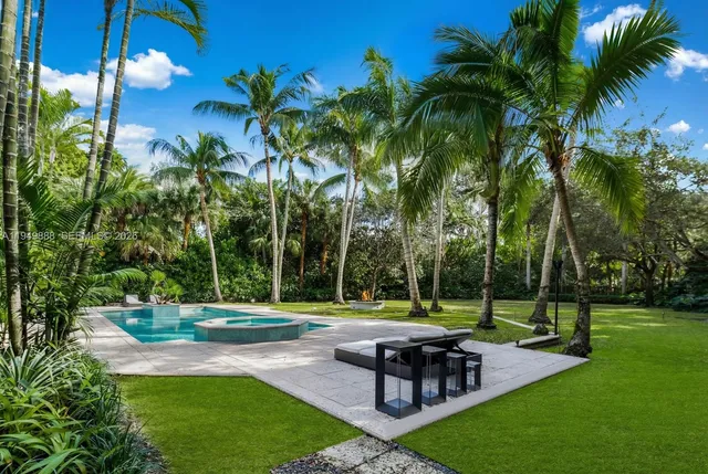 a garden with palm trees