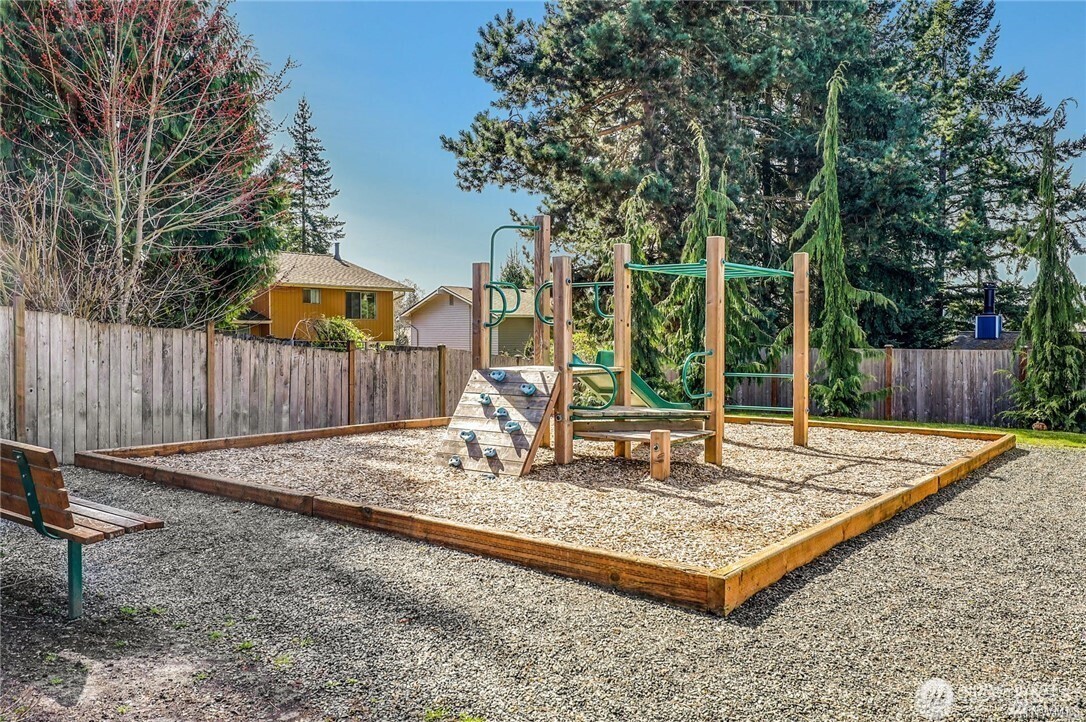 19607 25th Drive Southeast Bothell, WA 98012 - Photo 30 of 30 a view of a backyard with a tree and wooden fence