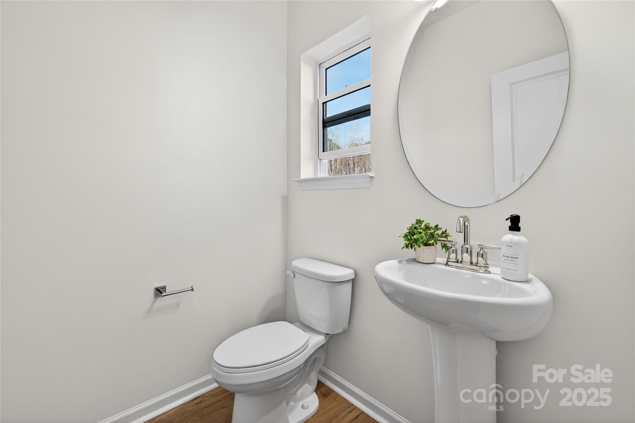10315 Lakeshore Drive, Unit 89 Lancaster, SC 29720 - Photo 16 of 43 a bathroom with a sink toilet and a mirror