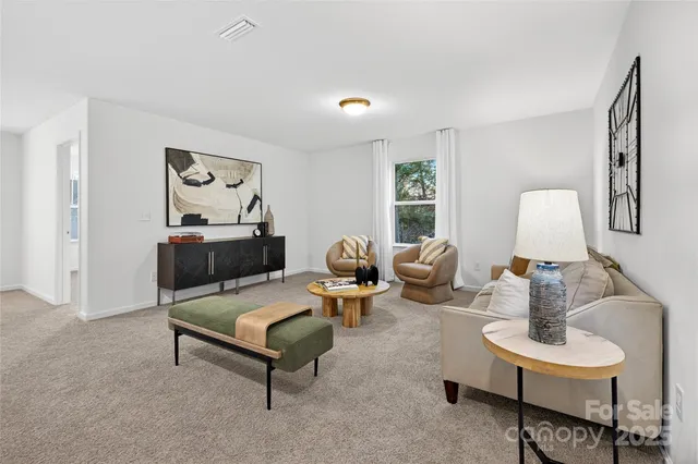 a living room with furniture and a lamp