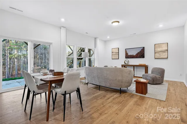 a living room with furniture and flat screen tv