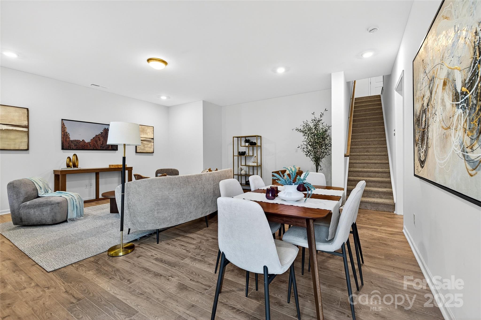 10315 Lakeshore Drive, Unit 89 Lancaster, SC 29720 - Photo 26 of 43 a dining room with furniture and wooden floor