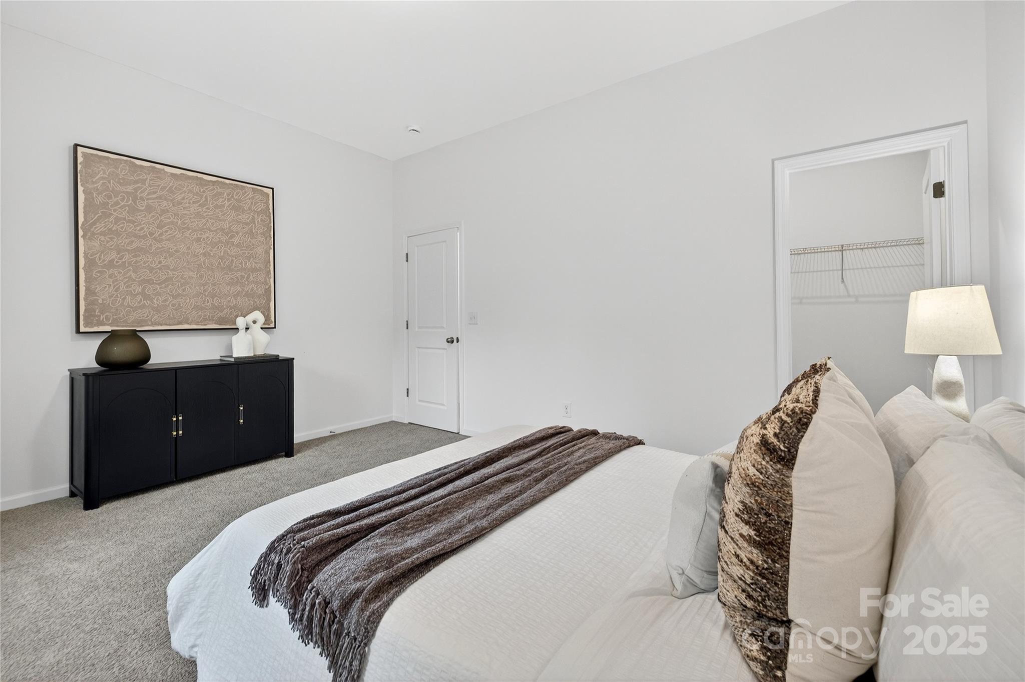 10315 Lakeshore Drive, Unit 89 Lancaster, SC 29720 - Photo 29 of 43 a bedroom with a bed and a lamp