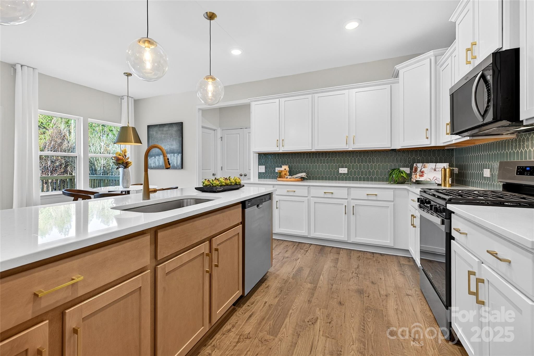 10315 Lakeshore Drive, Unit 89 Lancaster, SC 29720 - Photo 7 of 43 a kitchen with cabinets a sink a window and appliances