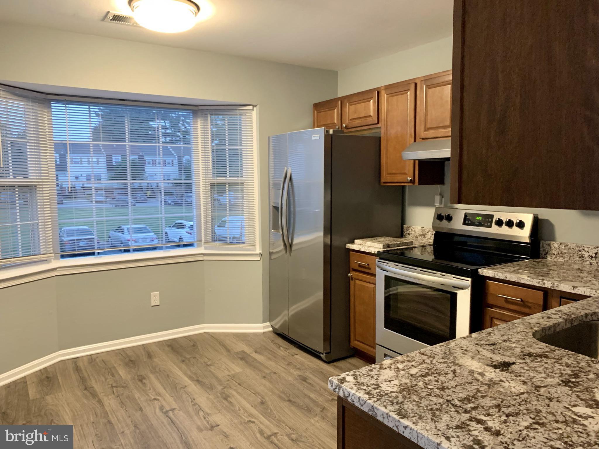 1667 Ridgely Court, Unit 178 Crofton, MD 21114 - Photo 6 of 33 Spacious Kitchen with Great Bay Window