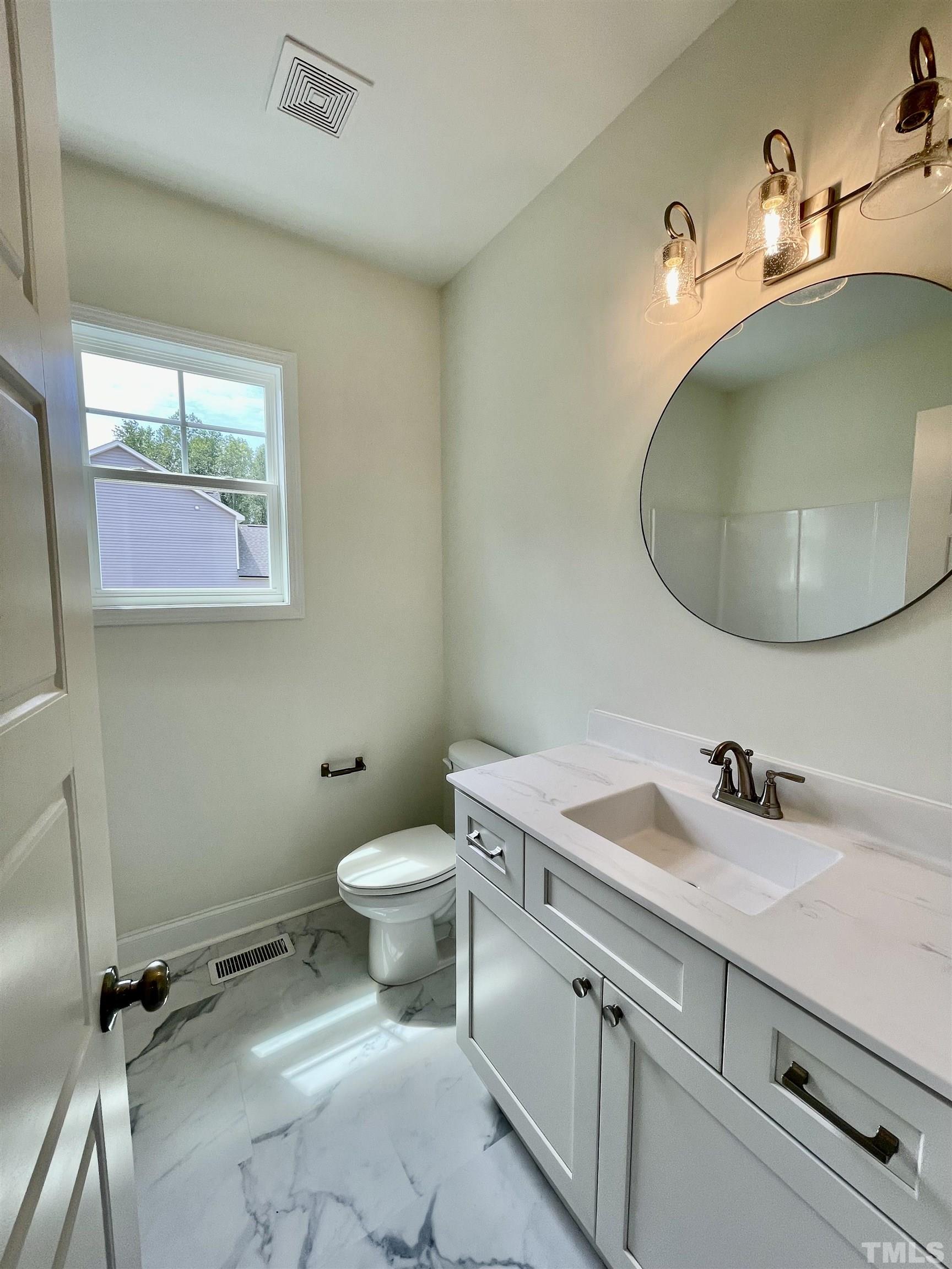 10623 West Old Spring Hope Road Spring Hope, NC 27882 - Photo 11 of 33 a bathroom with a sink and a mirror