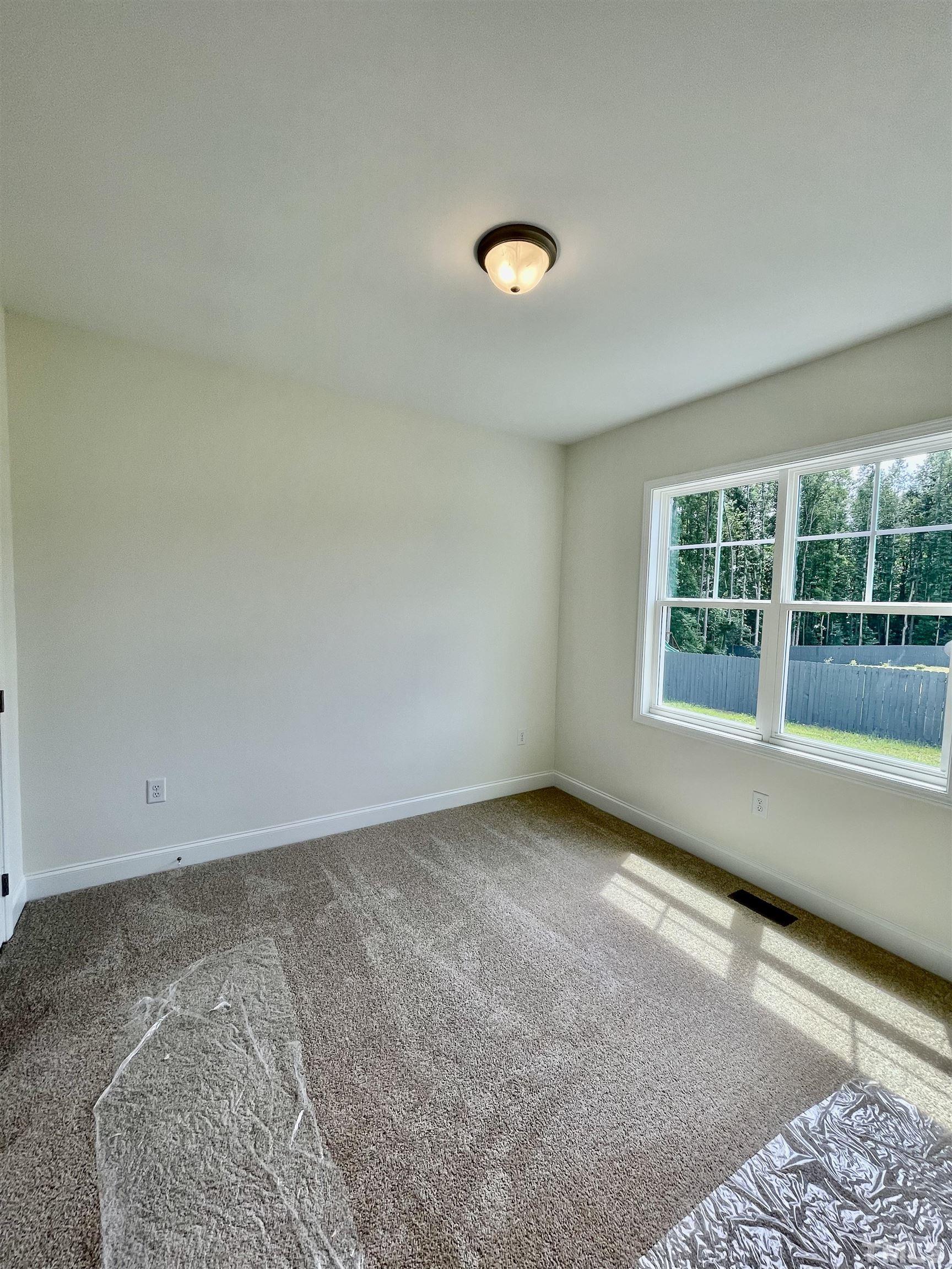 10623 West Old Spring Hope Road Spring Hope, NC 27882 - Photo 16 of 33 an empty room with a window