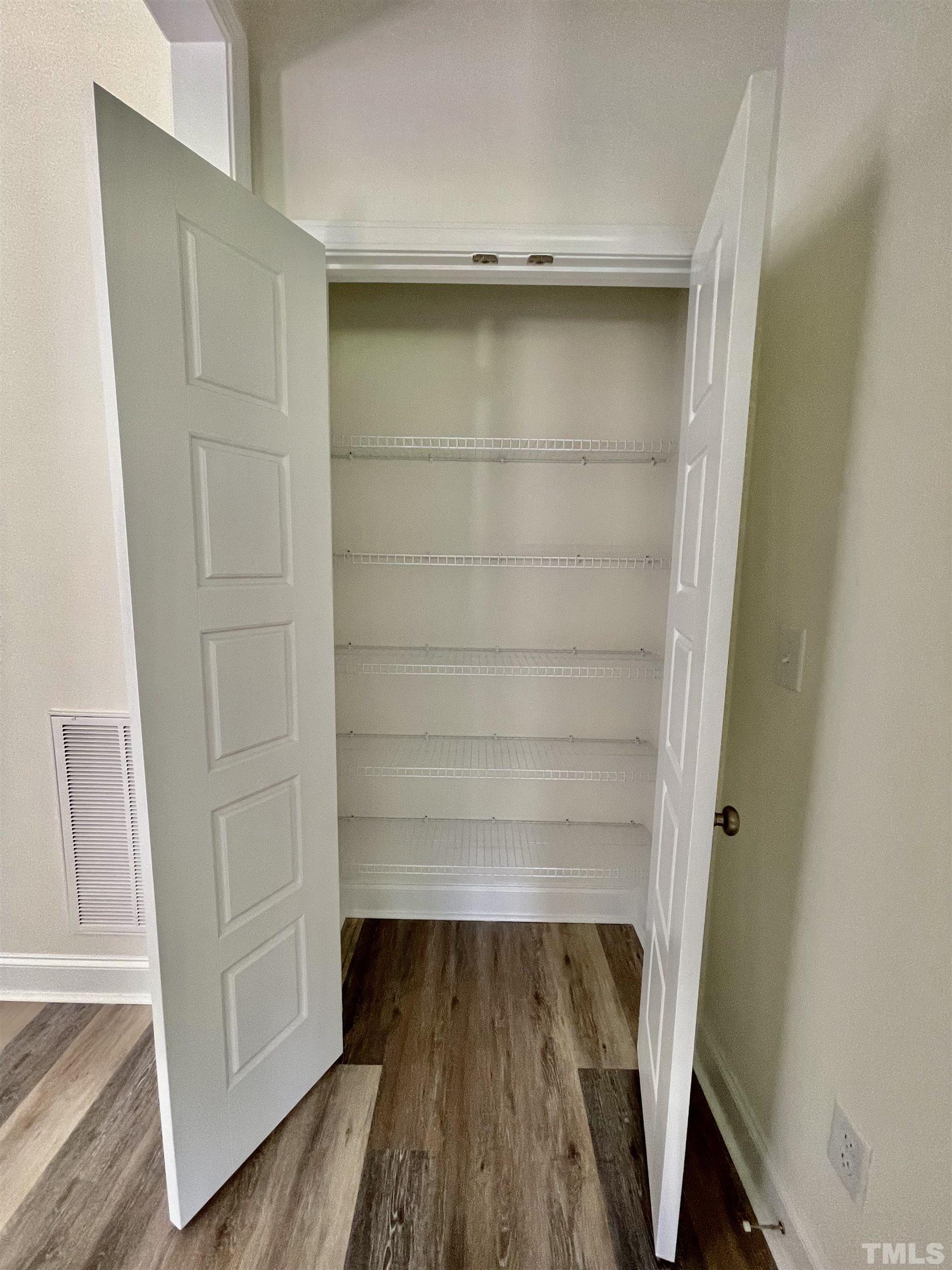 10623 West Old Spring Hope Road Spring Hope, NC 27882 - Photo 30 of 33 a view of walk in closet with empty racks