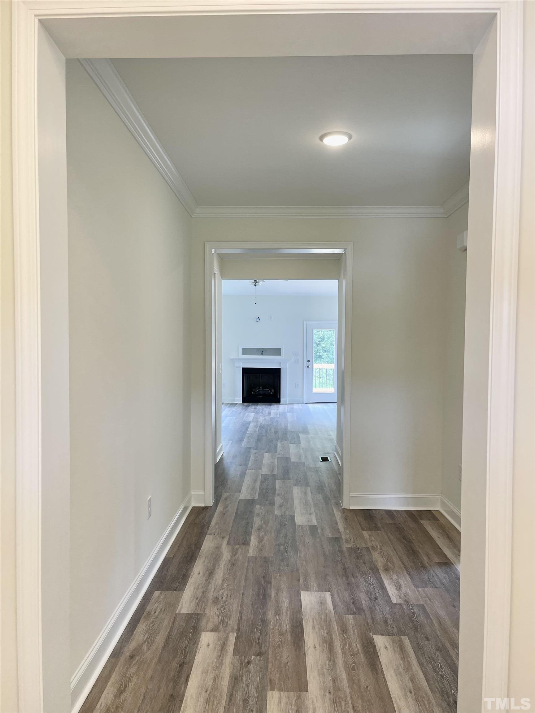 10623 West Old Spring Hope Road Spring Hope, NC 27882 - Photo 3 of 33 a view of empty room with wooden floor