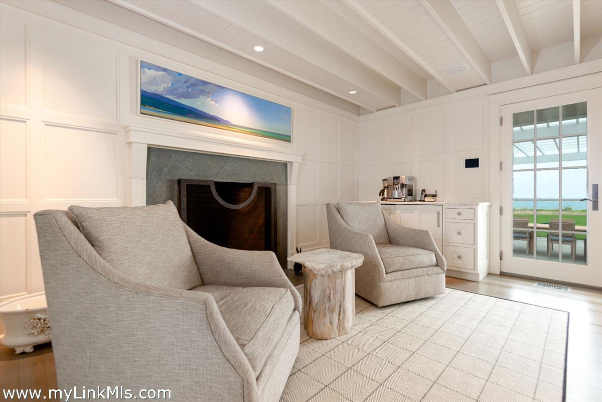 37 Sankaty Head Road Nantucket, MA 02554 - Photo 26 of 65 a living room with furniture and a fireplace
