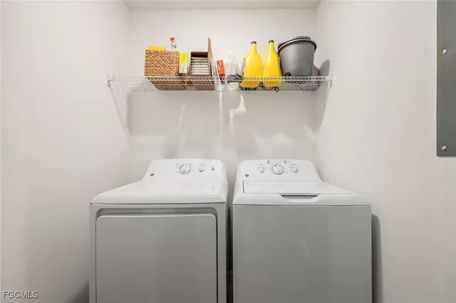 a utility room with dryer and washer