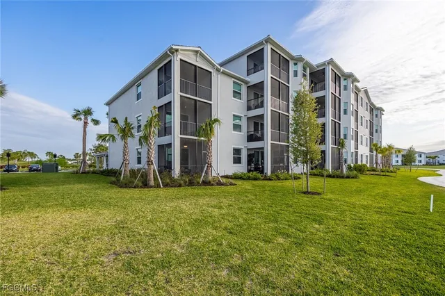 a view of a building with a yard
