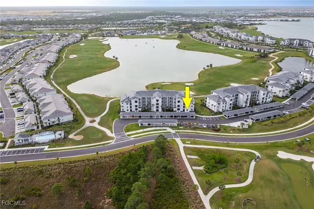 an aerial view of a house with a ocean view