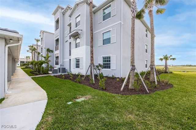 a view of a house with backyard and a slide