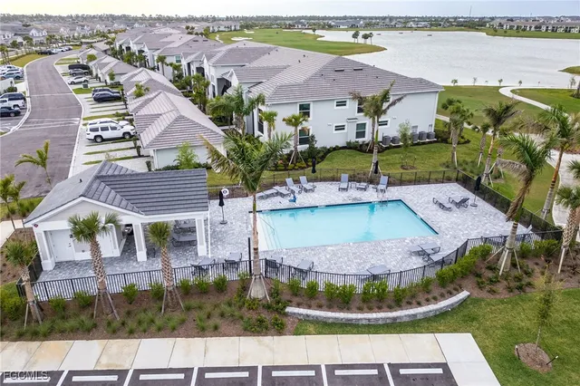 an aerial view of a house with a lake view