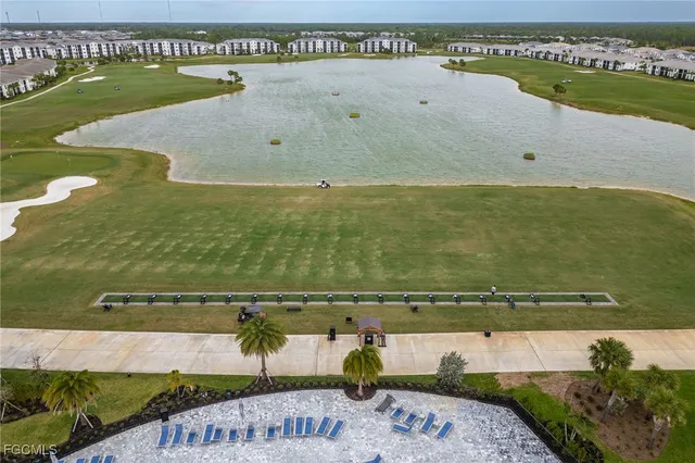 an aerial view of a house outdoor space swimming pool and ocean view