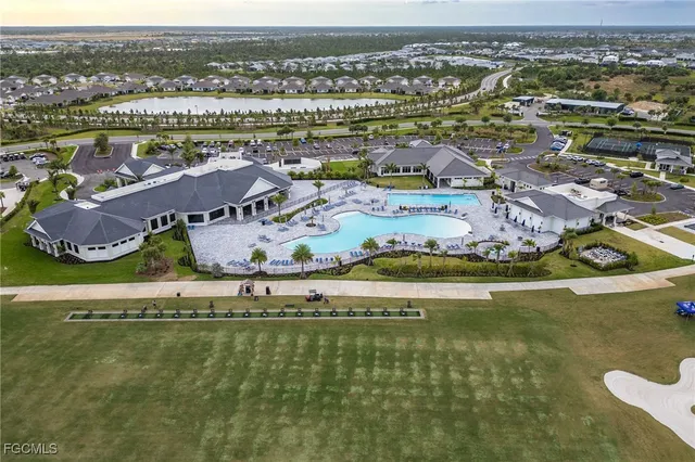 an aerial view of a house with a ocean view