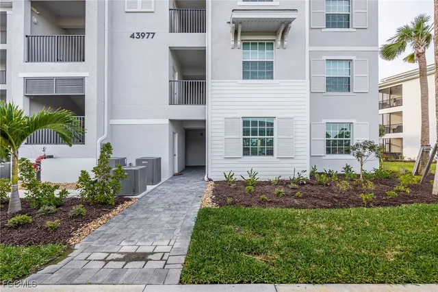 a view of a front of a house with a yard