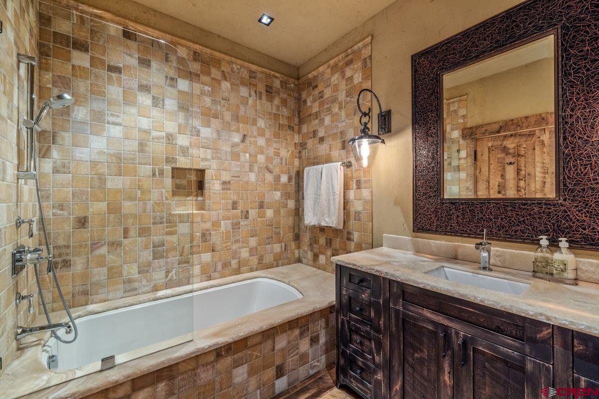 23 Gray Fox Lane Crested Butte, CO 81225 - Photo 28 of 45 a bathroom with a bathtub and a sink