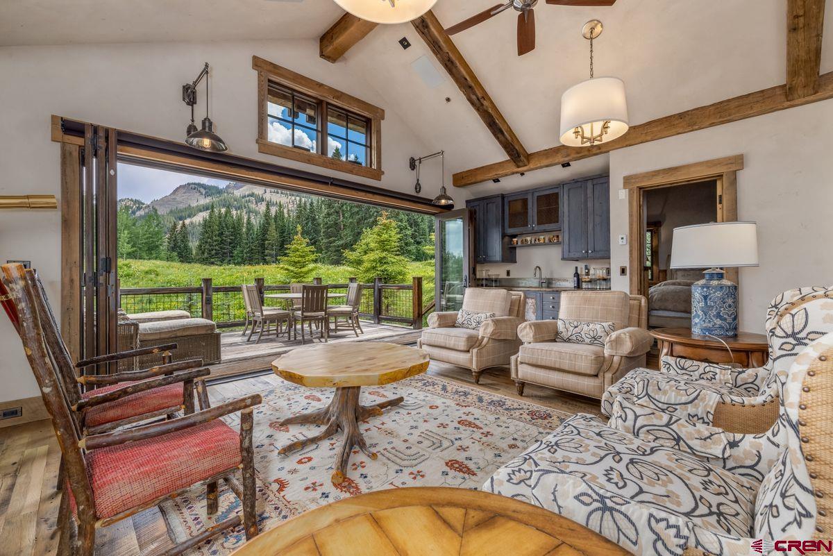23 Gray Fox Lane Crested Butte, CO 81225 - Photo 35 of 45 a living room with fireplace furniture and a large window