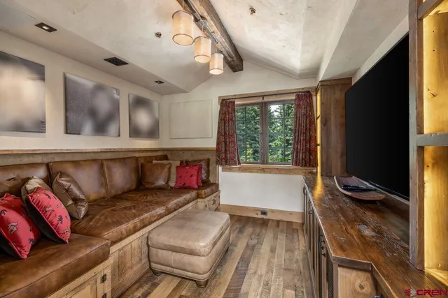 a bathroom with a granite countertop sink and a large mirror