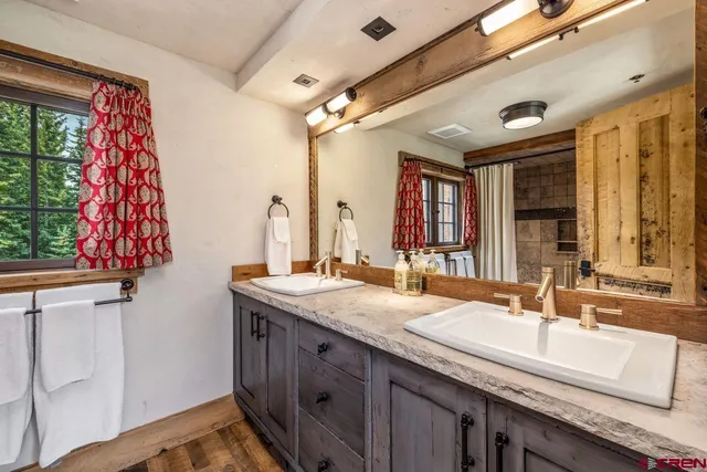 a view of a chairs and table in the backyard