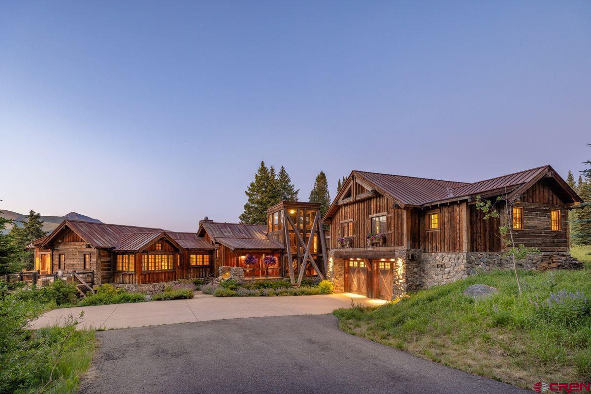 23 Gray Fox Lane Crested Butte, CO 81225 - Photo 45 of 45 a front view of a house with a yard and garage