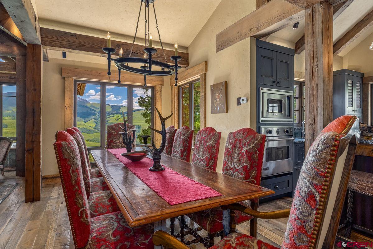 23 Gray Fox Lane Crested Butte, CO 81225 - Photo 9 of 45 a view of a dining room with furniture