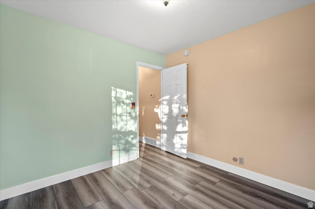 888 East 6895 South Midvale, UT 84047 - Photo 19 of 54 Versatile space with updated flooring, neutral tones, and easy access to adjacent areas of the home.