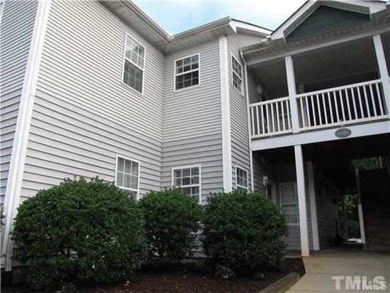 1305 Kent Road, Unit 102 Raleigh, NC 27606 - Photo 1 of 18 a view of a house with a yard