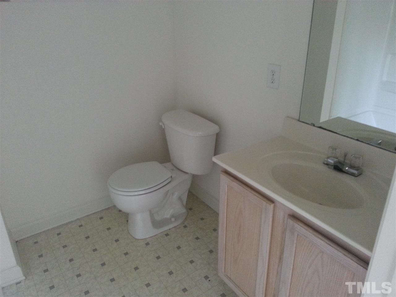 1305 Kent Road, Unit 102 Raleigh, NC 27606 - Photo 9 of 18 a bathroom with a sink and a toilet