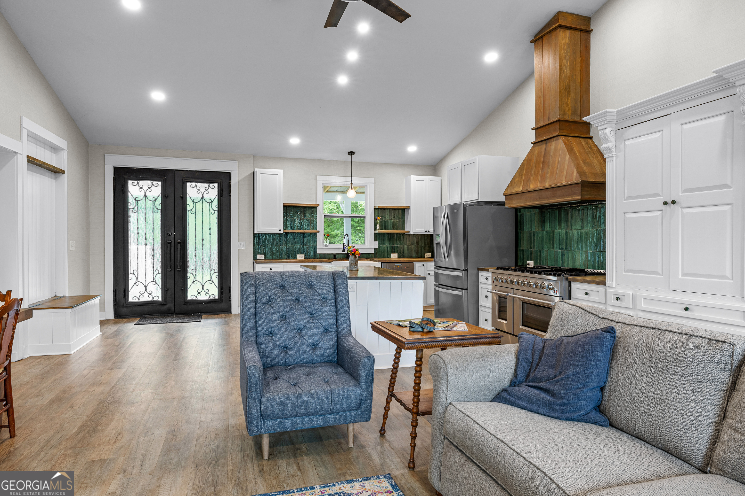 1329 Standing Rock Road Senoia, GA 30276 - Photo 31 of 77 a living room with furniture and a large window