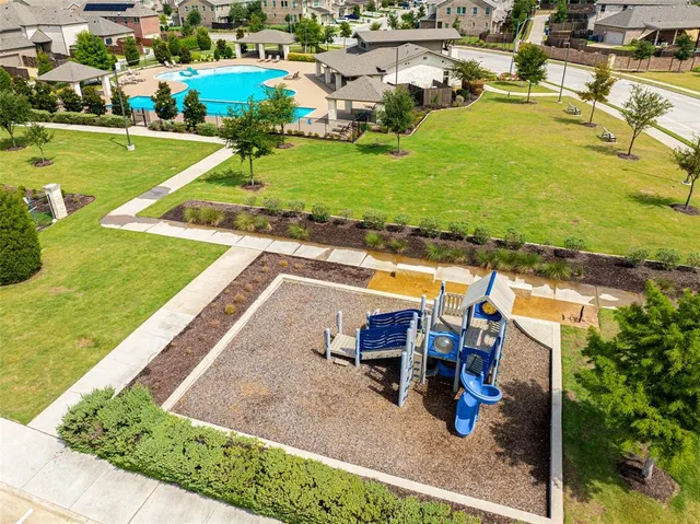 an aerial view of residential houses with outdoor space