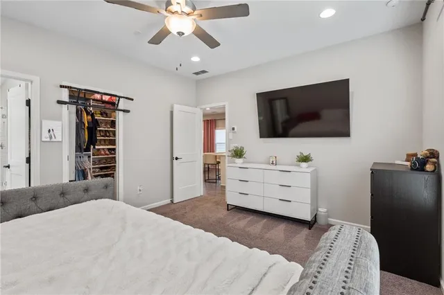 a room with a bed and a flat screen tv in it