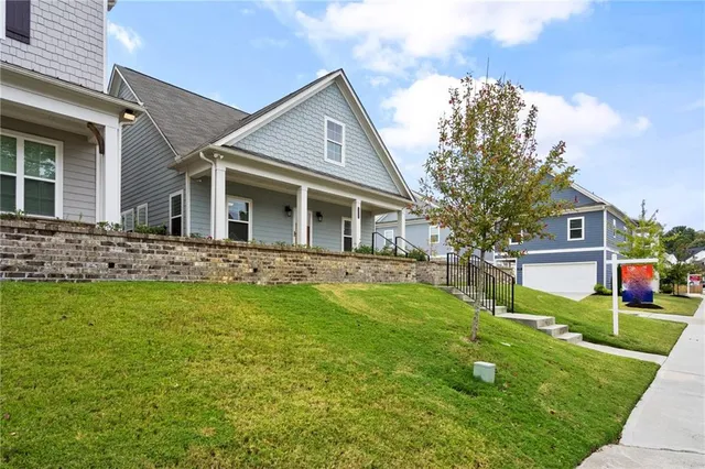a front view of a house with garden