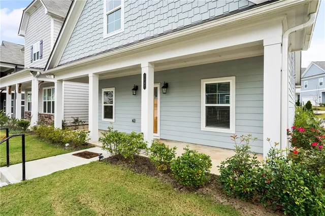 a front view of a house with garden