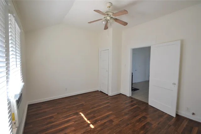 a kitchen with a stove and white cabinets
