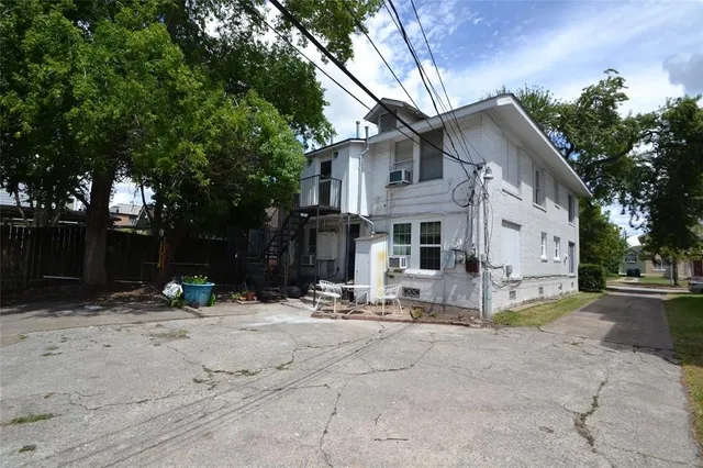 a view of a pathway with a wrought fence