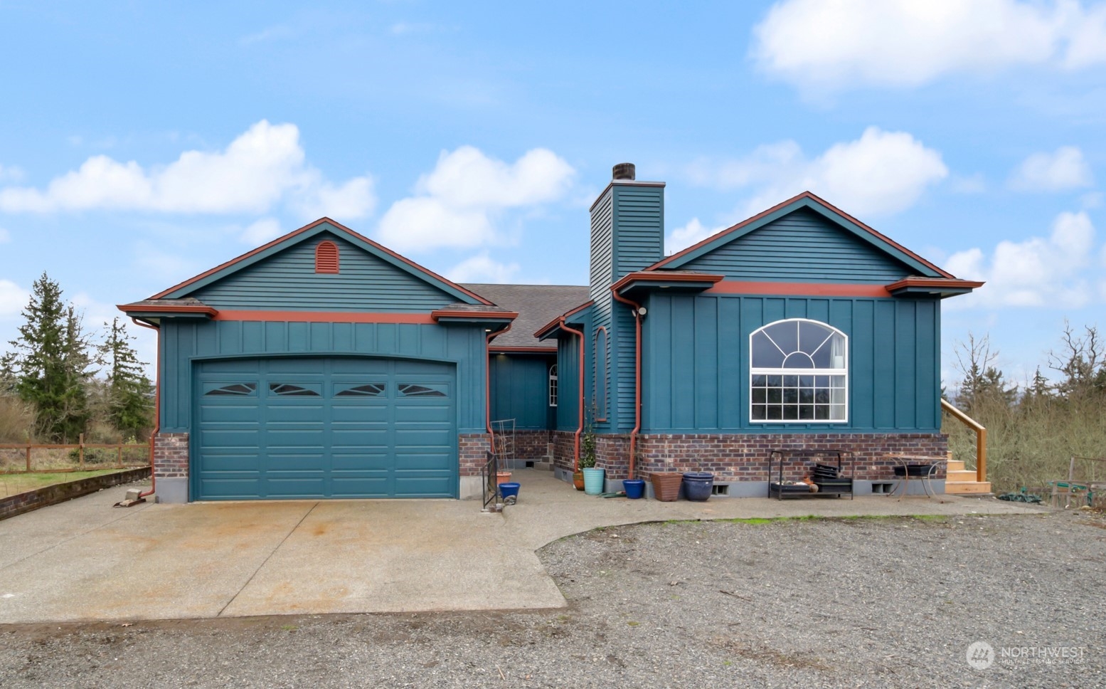 17141 Longmire Road Southeast Yelm, WA 98597 - Photo 1 of 29 a front view of a house with a yard and garage