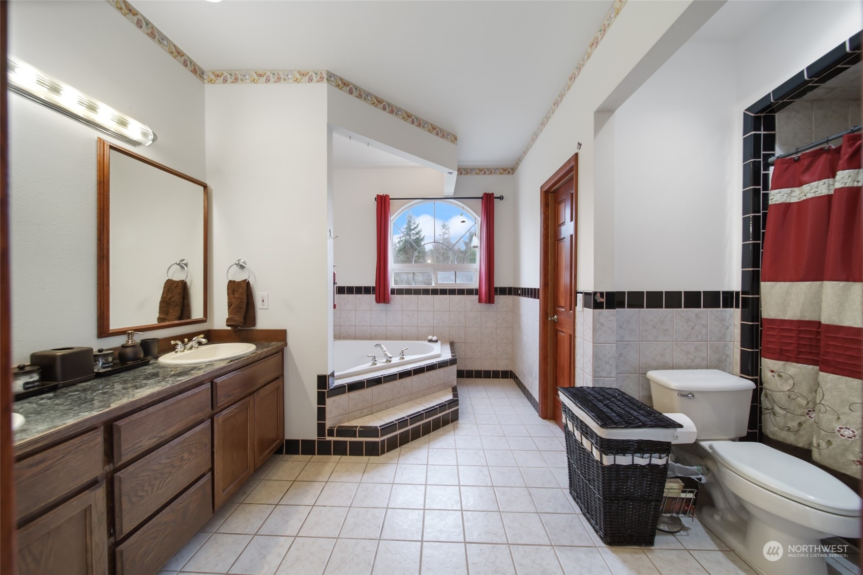17141 Longmire Road Southeast Yelm, WA 98597 - Photo 12 of 29 a bathroom with a toilet sink and mirror
