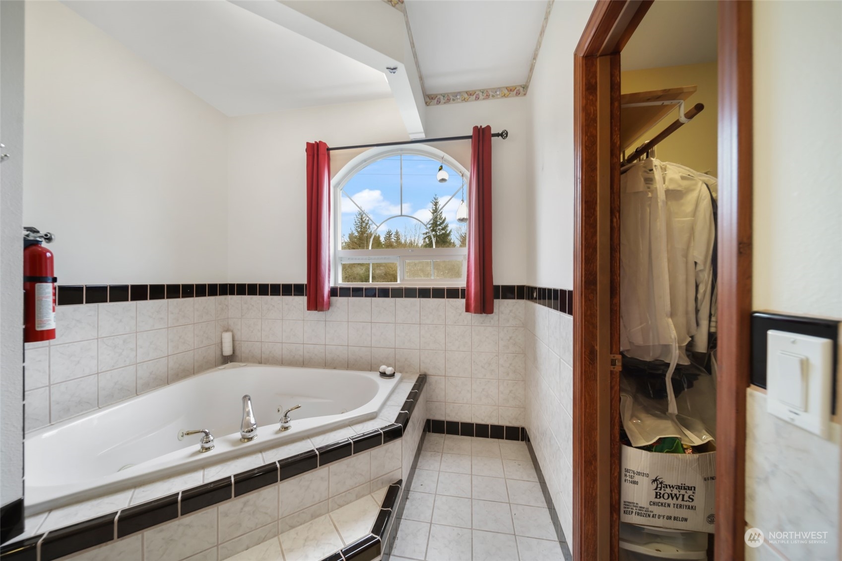 17141 Longmire Road Southeast Yelm, WA 98597 - Photo 13 of 29 a bathroom with a tub and a shower